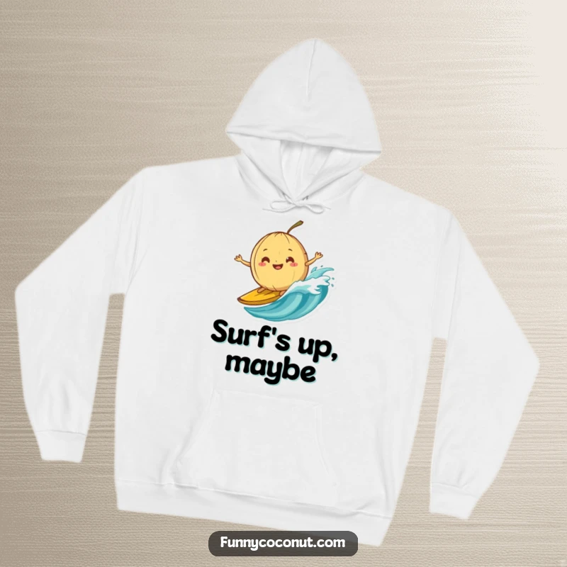 Funny hoodie showing a silly-grinning coconut attempting to surf on a banana peel wave, embodying adventurous fun.