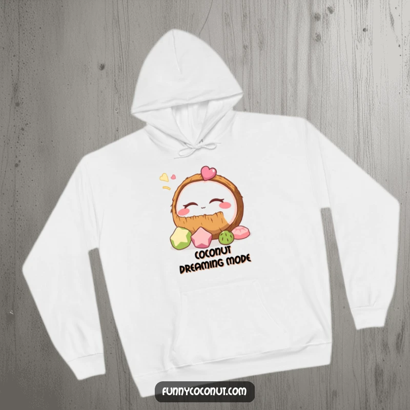Funny coconut hoodie depicting a coconut serenely dreaming of delicious snacks, designed for ultimate comfort and a good laugh.