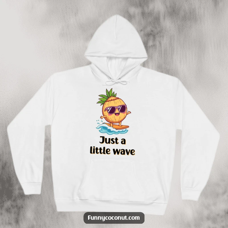 Funny Coconut Surfer Hoodie: A delighted coconut character wearing sunglasses surfs a tiny wave, offering cozy warmth and cool, beachy style.