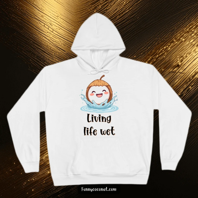 Funny hoodie illustrating a grinning coconut gleefully splashing in water, capturing a moment of pure, unadulterated fun.