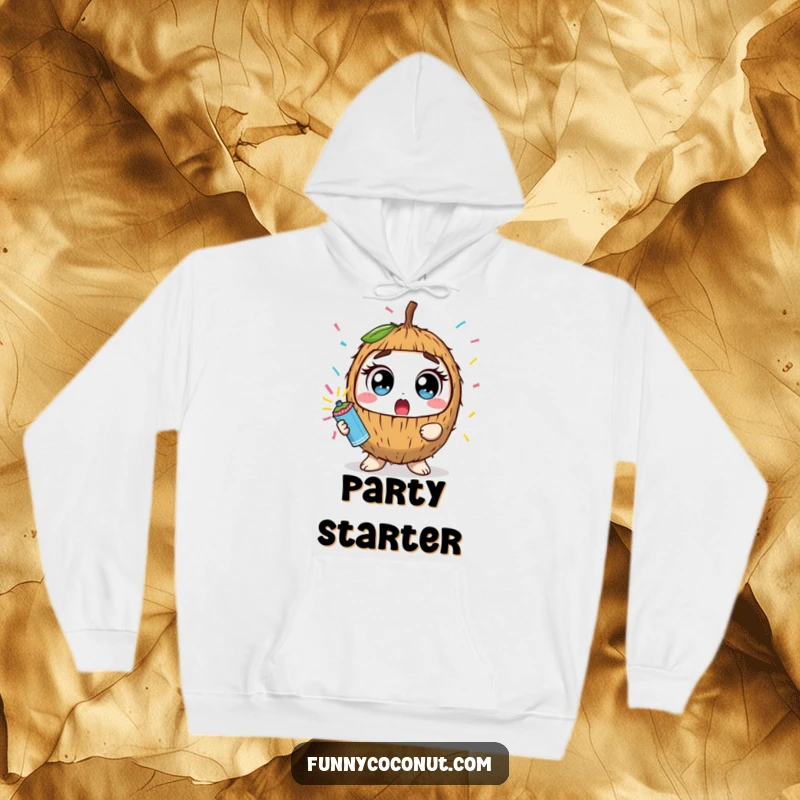 Funny kawaii coconut with wide eyes holding a confetti popper, on a cozy hoodie, ready for festive moments.