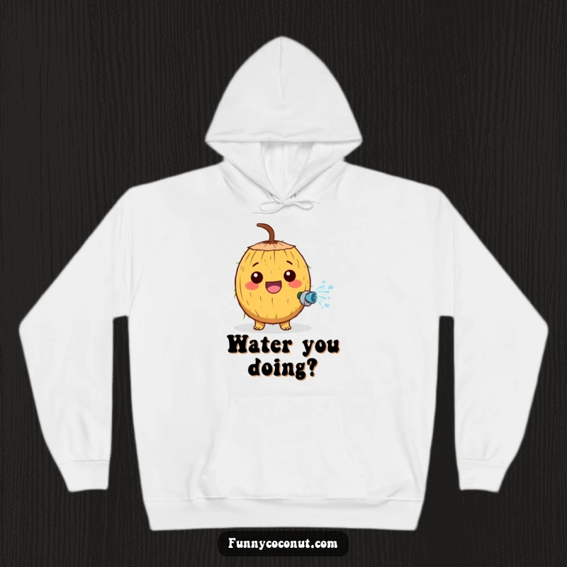 Funny hoodie with a cheerful coconut character joyfully spraying water from a tiny hose, radiating playful energy.